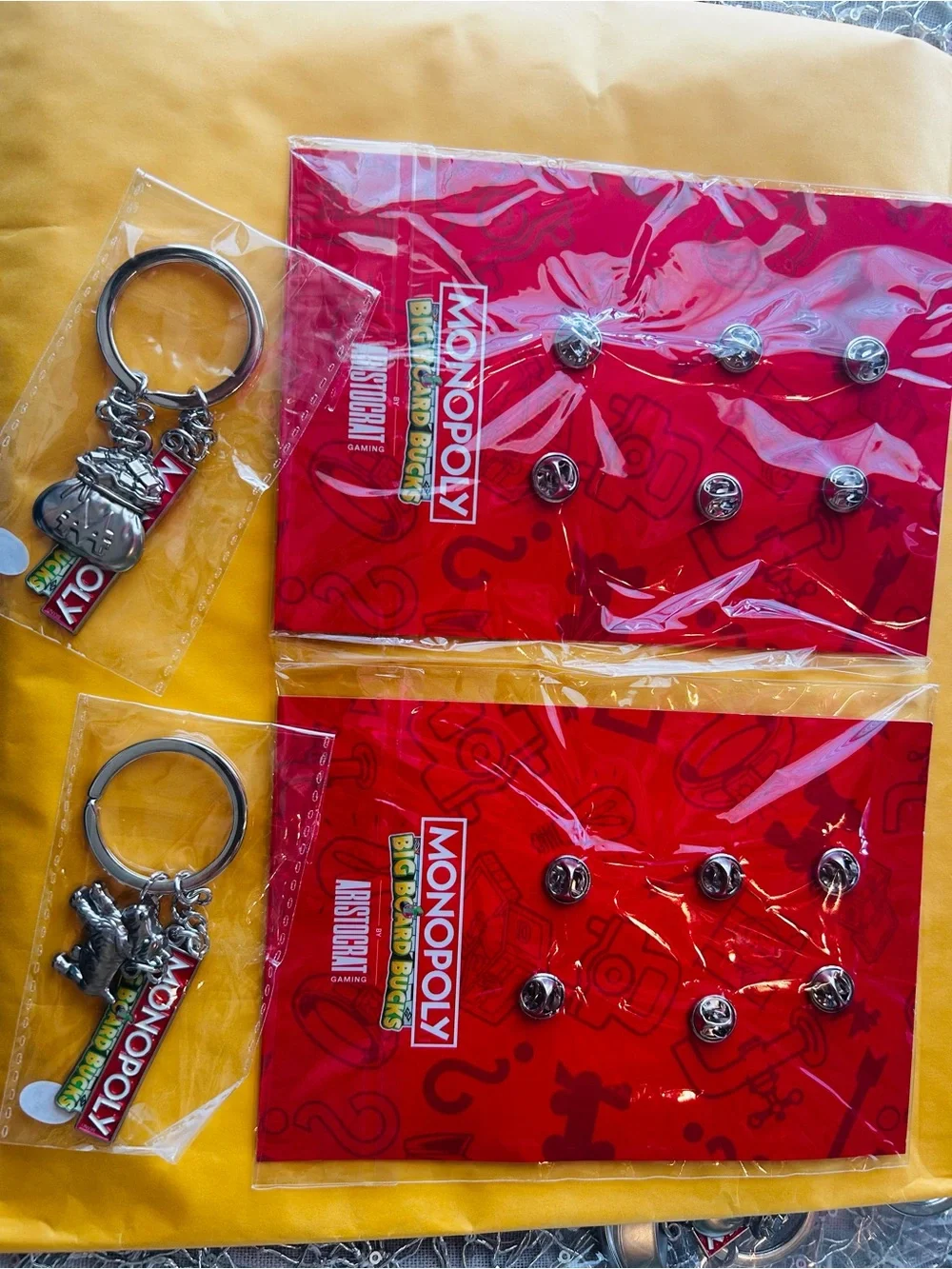 Monopoly Big Board Bucks enamel pins & keychain